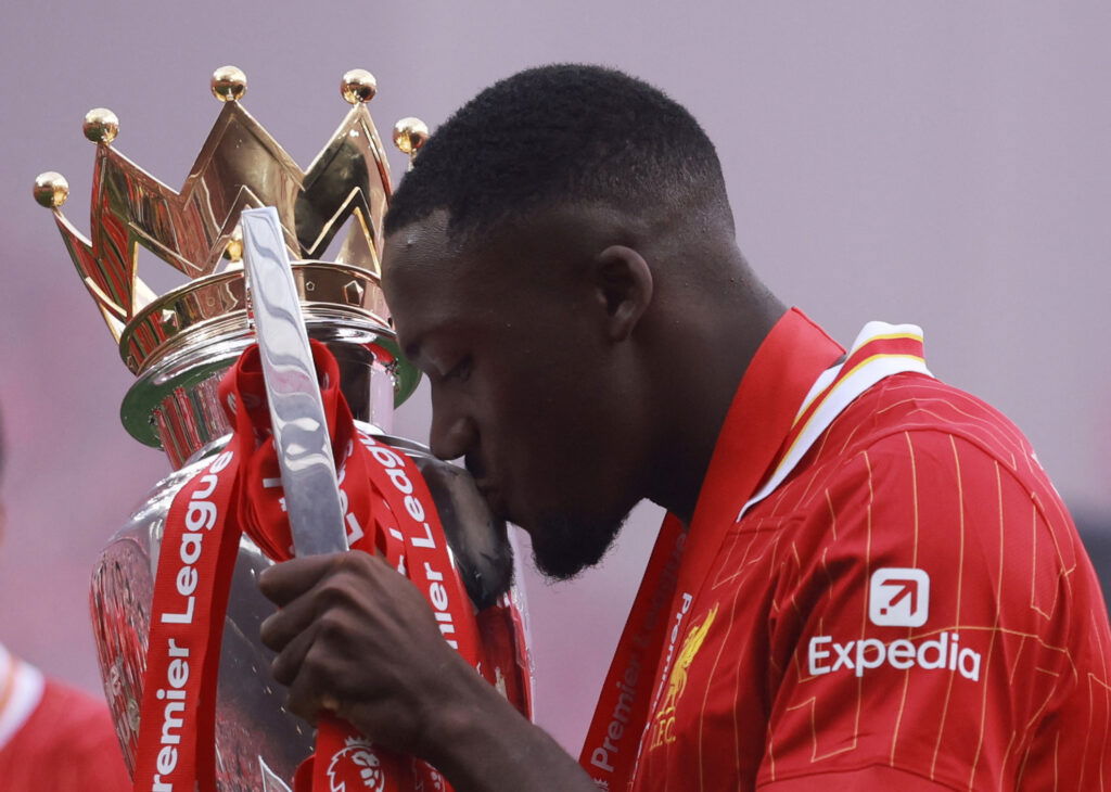 Liverpool's Ibrahima Konate celebrates with the trophy after winning the Premier League 