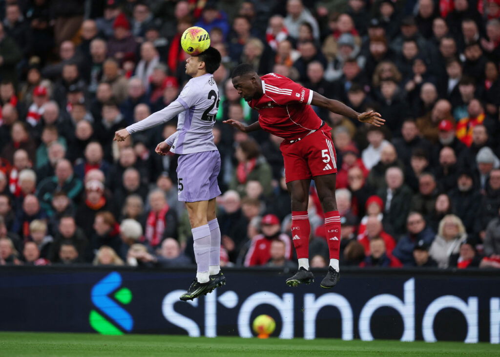 Ibrahima Konate contests a header in the Premier League against Brighton at Anfield