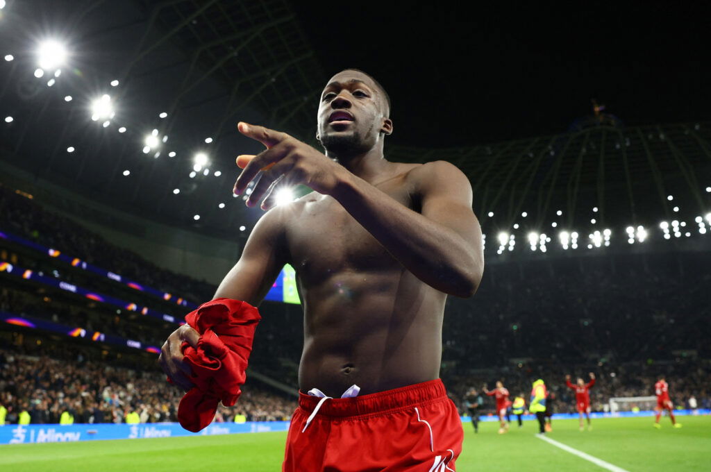 Liverpool's Ibrahima Konate gives his shirt to a fan after the match
